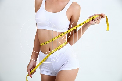 young woman with beautiful body and measure tape